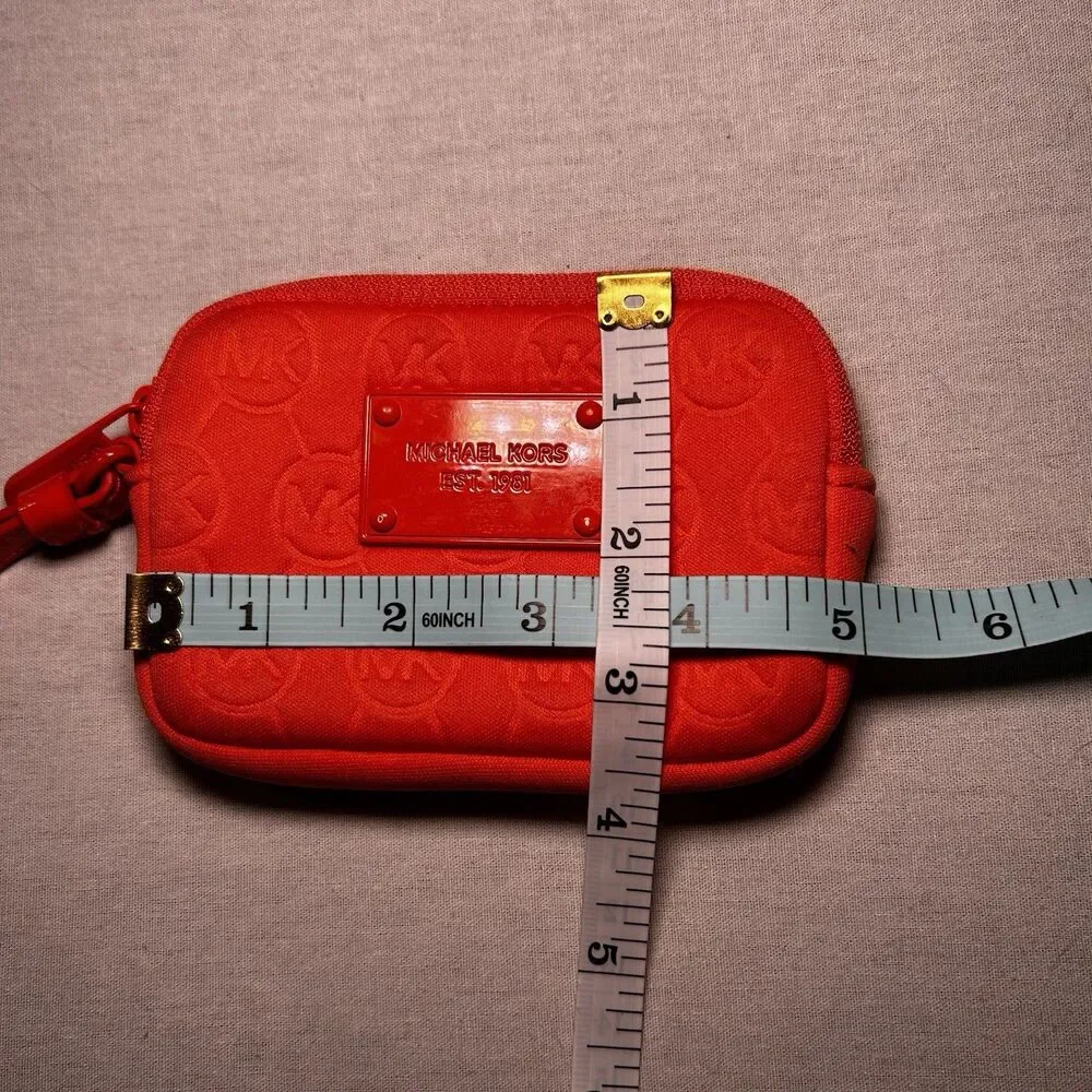 bright orange Michael Kors neoprene wristlet with a matching strap